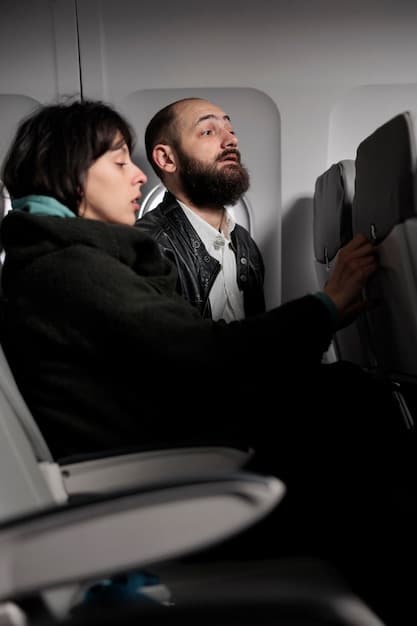 An interior shot of an airplane cabin, showcasing comfortable seating, clean interiors, and attentive flight attendants serving passengers.