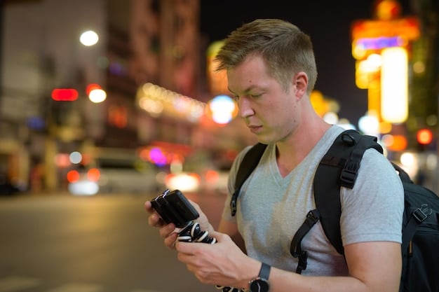 A medium shot of a traveler using a smartphone to check local news and emergency alerts while standing in an airport terminal. The background shows blurred movement of other travelers and airport signage.
