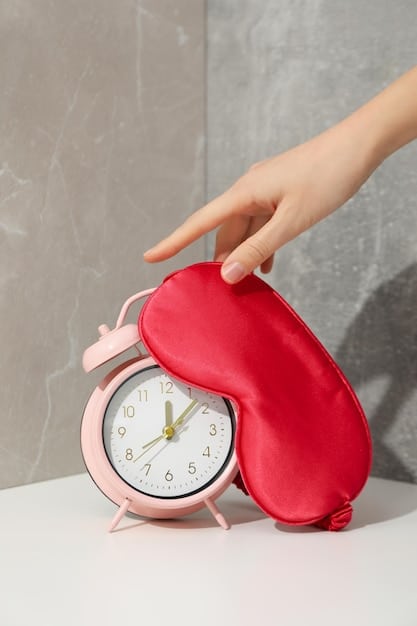 A close-up shot of a hand holding a small, pink personal alarm. The alarm is attached to a keychain, and the background is blurred to emphasize the device.
