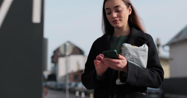A woman using her smartphone to navigate a map in a well-lit urban environment, confidently holding her phone with a secure grip.