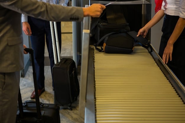 A traveler placing a jacket and belt into a bin at an airport security checkpoint, with their carry-on bag on the conveyor belt. Focus on the efficient disposal of these items.