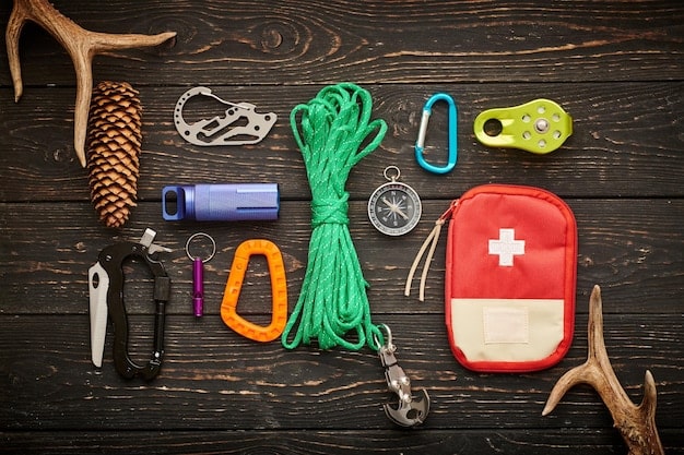 A close-up view of an emergency kit, showcasing items like a first aid kit, flashlight, jumper cables, and reflective triangles.