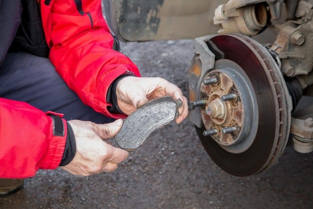 A close-up of a mechanic inspecting a car's disc brake, with a caliper, rotor, and brake pads visible, emphasizing the importance of professional brake maintenance for road trip safety.