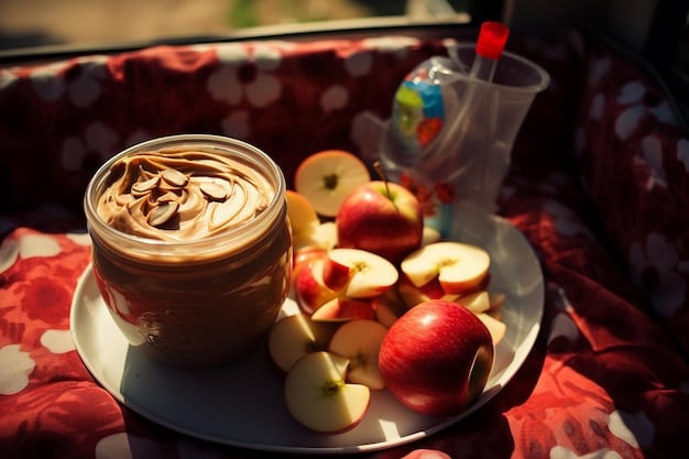 Close-up of various healthy road trip snacks such as trail mix, apple slices with peanut butter, baby carrots, whole-grain crackers, and homemade energy bars. The snacks are arranged attractively on a wooden surface.