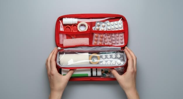 A person carefully organizing medical supplies into a first aid kit, including bandages, antiseptic wipes, pain relievers, and gloves.