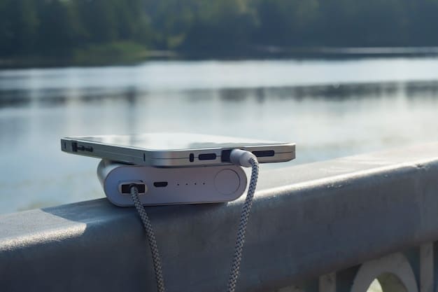 A close-up shot of a portable power station placed on the trunk of a car during a road trip, showing different charging ports and a digital display indicating battery level. Various devices such as a smartphone, tablet, and camera are connected and charging. The background includes a scenic landscape, emphasizing the utility and convenience of the power station for outdoor adventures.