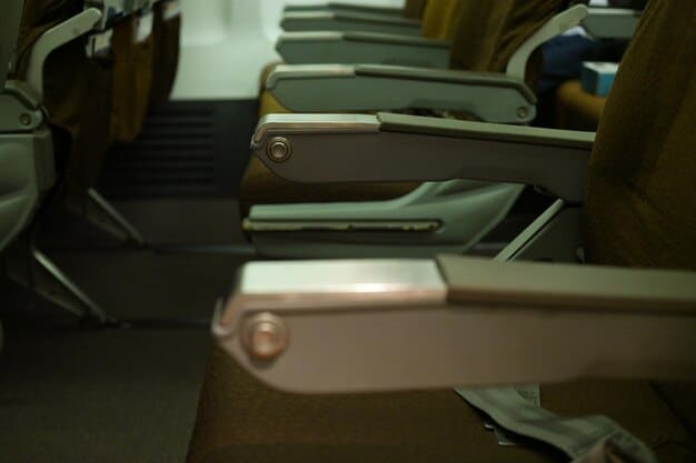 Inside an airplane cabin, showing a row of economy class seats. The focus is on the limited legroom and the passengers struggling to get comfortable. The lighting is a bit cramped and emphasizes the tight seating arrangement.
