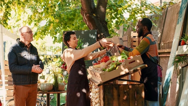Depict several people visiting a farm and buying fresh vegetables from local vendors. The image represent the local tourism and support to the community.