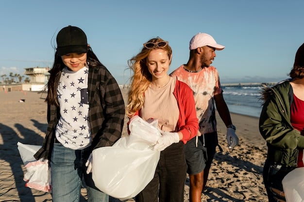 A group of teenagers participating in a beach cleanup in Southern California. They are picking up trash along the shoreline, including plastic bottles, cans, and other debris, illustrating environmental responsibility and community involvement. The background features the ocean and a clear blue sky