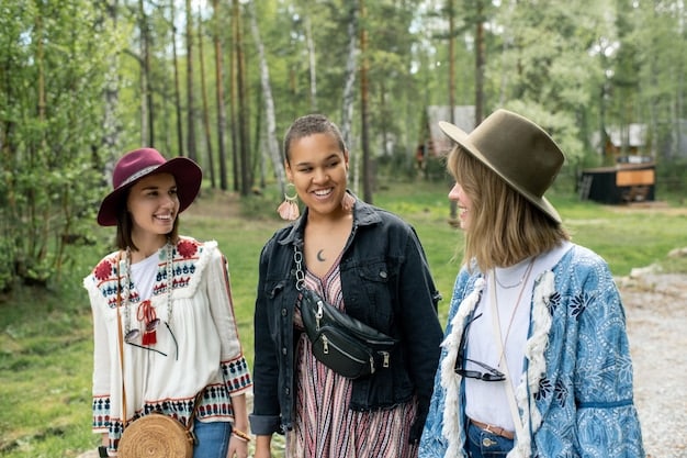 A group of tourists participating in a community-based tourism project in a rural area of the US, helping with reforestation efforts and learning about local culture and traditions.