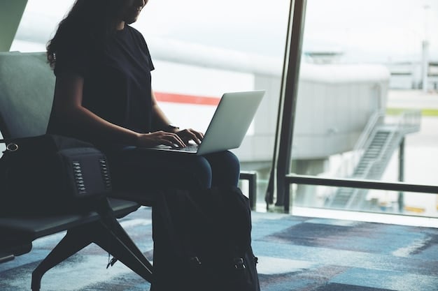 A travel journalist working on a laptop in an airport lounge, with a plane taking off in the background. The image should convey the idea of balancing work and travel while dealing with regulatory changes.