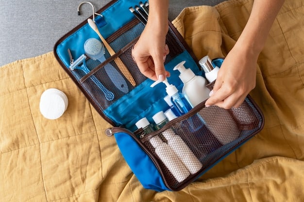 An open suitcase with neatly rolled clothes, packing cubes, and travel-sized toiletries, demonstrating efficient packing techniques for carry-on travel.