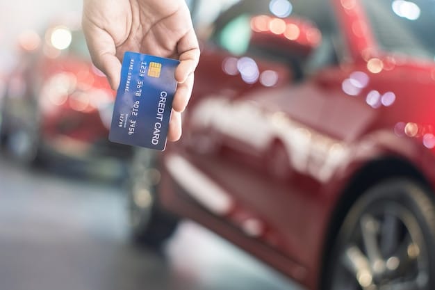 A close-up of a credit card with a rental car company logo on it, suggesting the use of credit card rewards for rental car benefits.