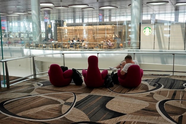 An aerial shot of a modern US airport lounge, showcasing comfortable seating, food and beverage options, and travelers relaxing before their flights.