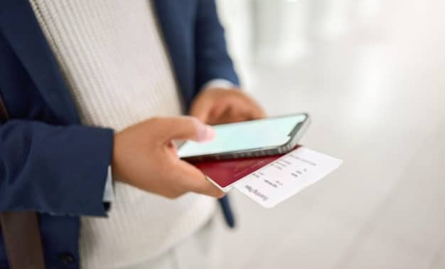A close-up of a US passport with travel documents and a smartphone displaying the Smart Traveler Enrollment Program (STEP) website on a table at an airport cafe.