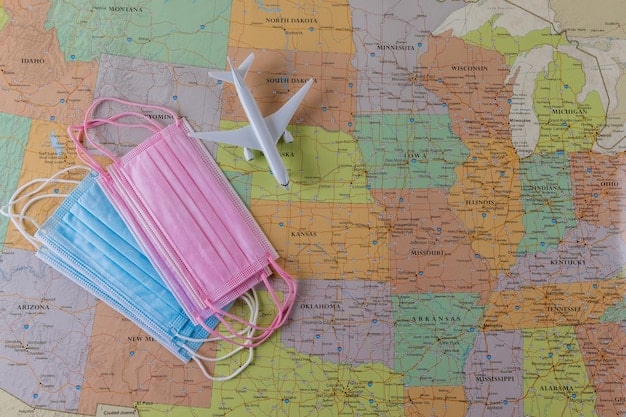 A map of the United States highlighting individual states with different color codes indicating their current COVID-19 related travel restrictions.
