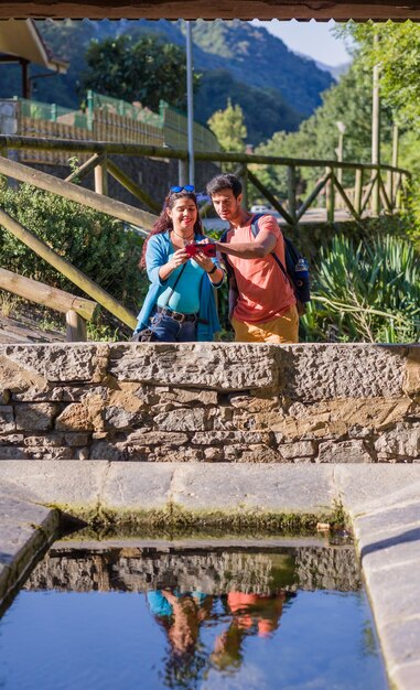 A photograph showcasing a community-led tourism project in a rural village, with tourists interacting with local artisans and participating in traditional activities. This highlights the social and economic benefits of sustainable tourism.