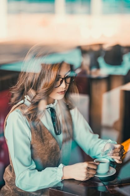 A travel writer sitting at a cafe, wearing AR glasses that overlay digital information about the surrounding environment. They are typing on a laptop, presumably writing about their experiences while using the AR technology.
