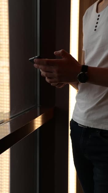 A traveler effortlessly unlocks a hotel room door with a smartphone displaying a Hilton Honors digital key. The background showcases a modern and stylish hotel corridor.