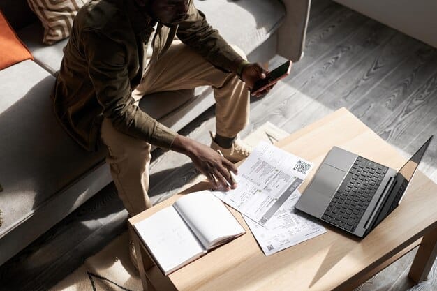 A person sitting at a desk with a laptop, reviewing travel expenses and receipts, symbolizing the preparation for claiming travel tax credits. The scene is set in a home office environment.