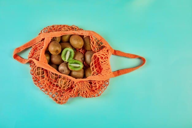 An overhead shot of a reusable mesh produce bag filled with colorful fruits and vegetables, emphasizing the practicality of carrying reusable bags while traveling to avoid single-use plastics at markets and grocery stores.