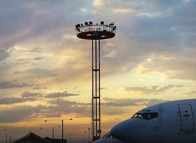 An image of a modern airport control tower with radar equipment, representing the technological changes prompted by the new FAA regulations for air traffic control.