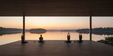 Sunrise yoga session at a tranquil wellness resort, promoting health and relaxation.